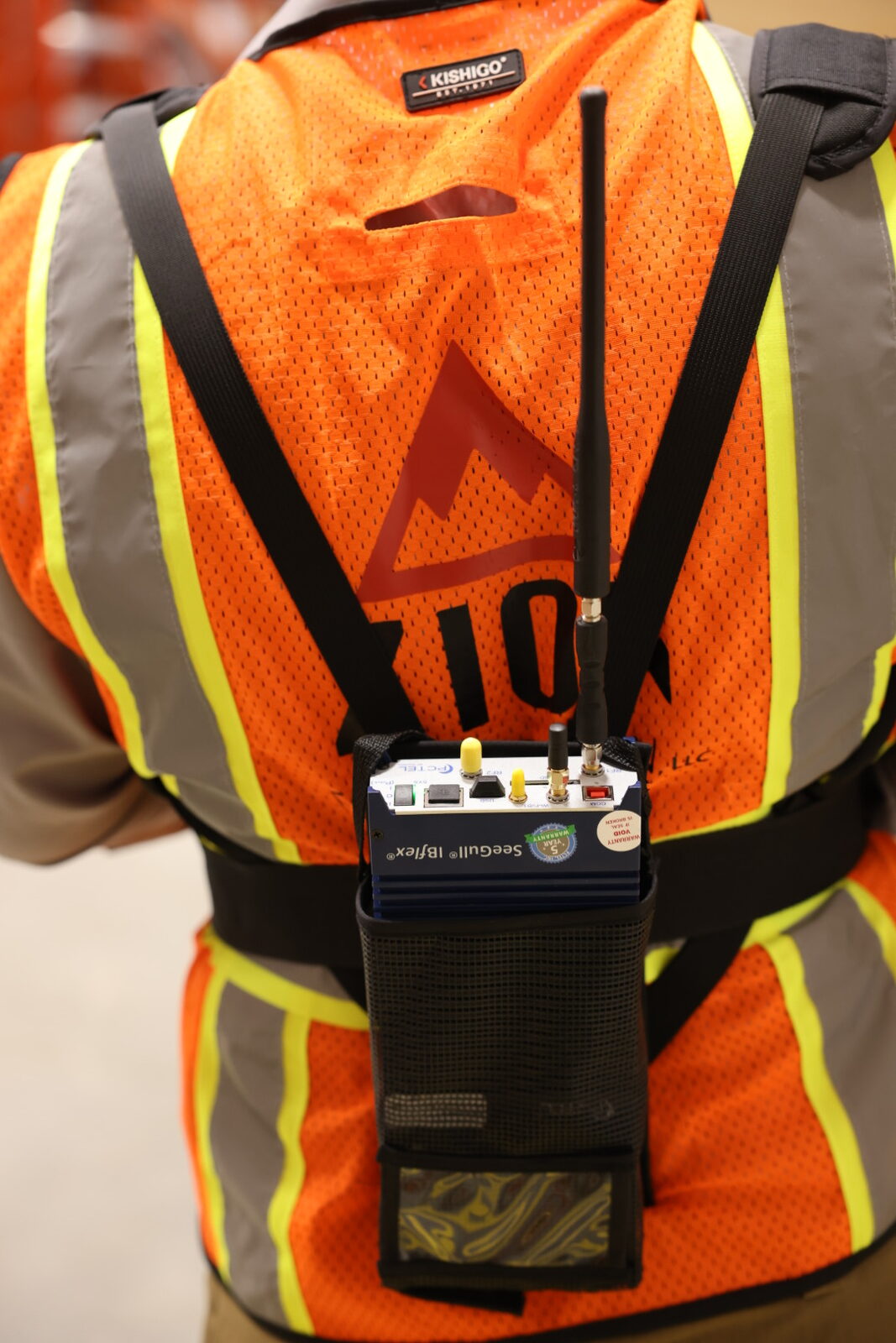 PCTEL SeeGull IBflex RF survey receiver mounted on a Kishigo high-visibility vest with Zion logo